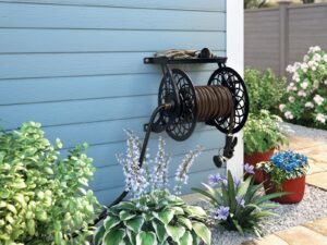 Suncast 125 ft. Slide Trak Decorative Metal Wall Mount Garden Hose Reel with Shelf, Black